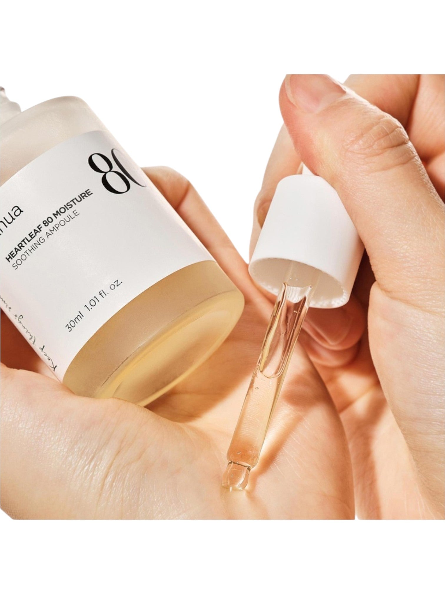 Skincare product with dropper being held by hands on a white background. Anua, Monza Outlet, Monza Fashion, Shein Outlet