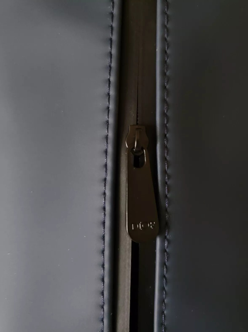 Close-up of a zipper on a gray fabric background monza outlet, Shein outlet, monza fashion
