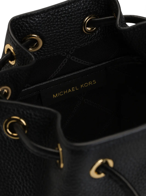Close-up of a black leather bag with gold hardware, featuring the Michael Kors logo. Michael Kors Monza Outlet