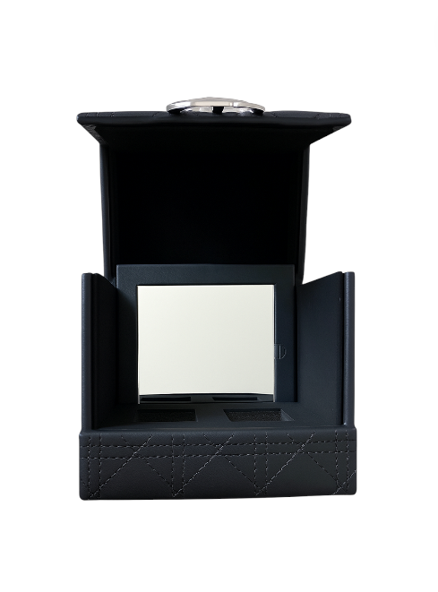 Black jewelry box with a ring on a white background. Dior Monza Outlet