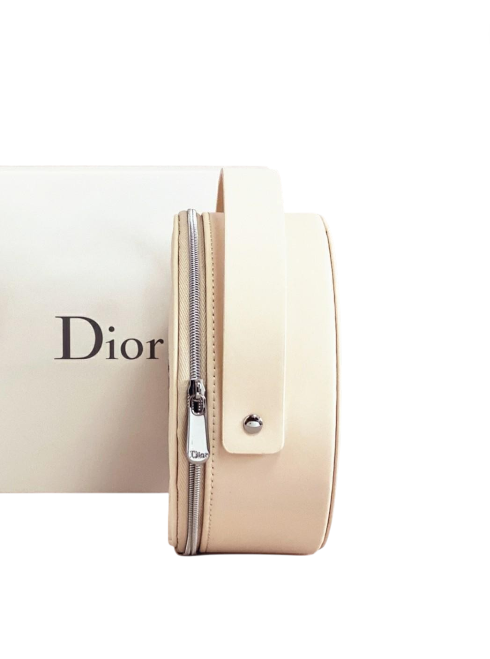 Beige Dior cosmetic bag with a white background. Monza Outlet