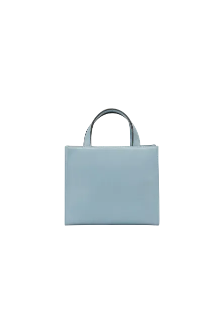 Light blue handbag on a white background. Guess, Monza Outlet, Monza Fashion, Shein Outlet