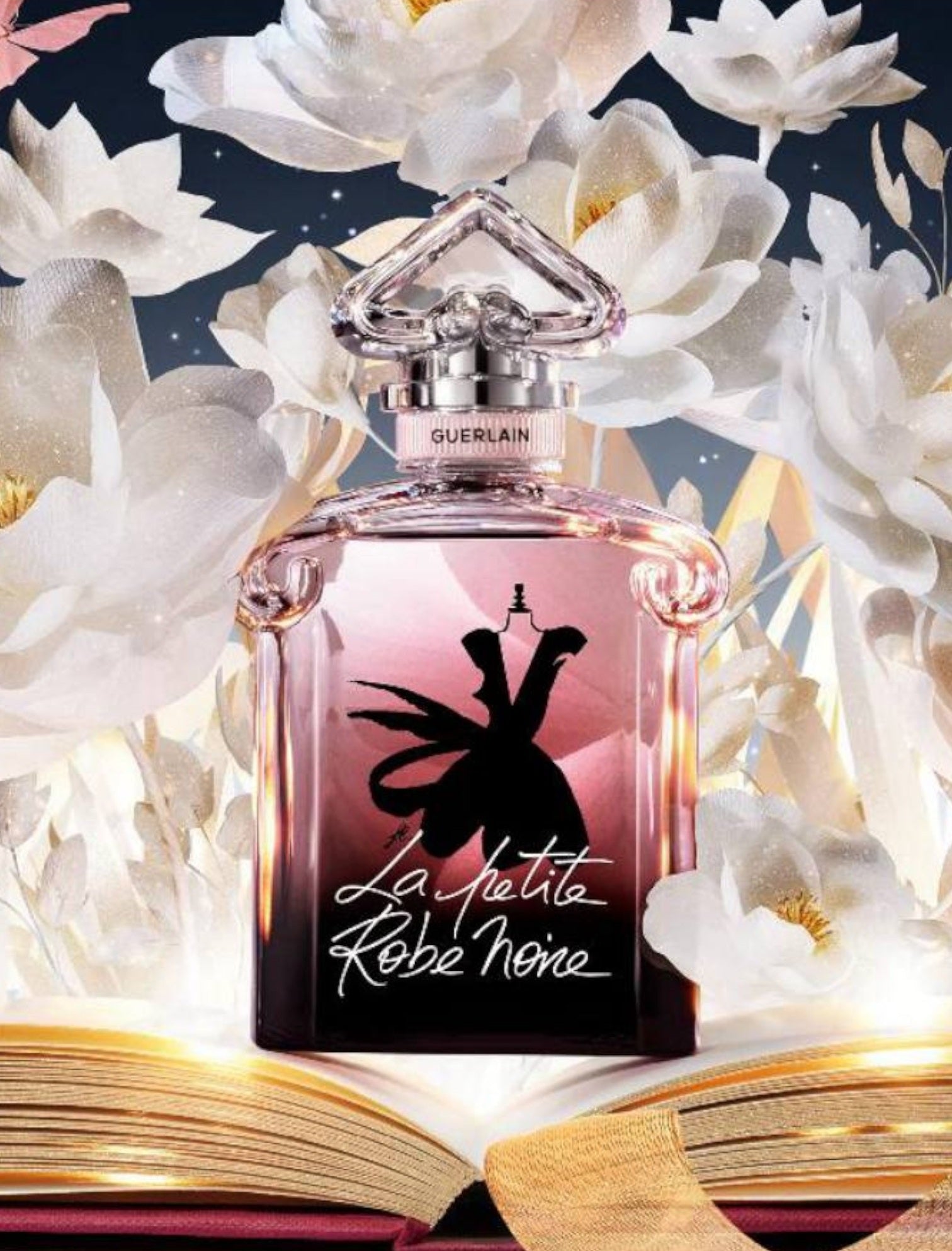 Guerlain perfume bottle with floral and book background. Guerlain, Monza Outlet, Monza Fashion, Shein Outlet