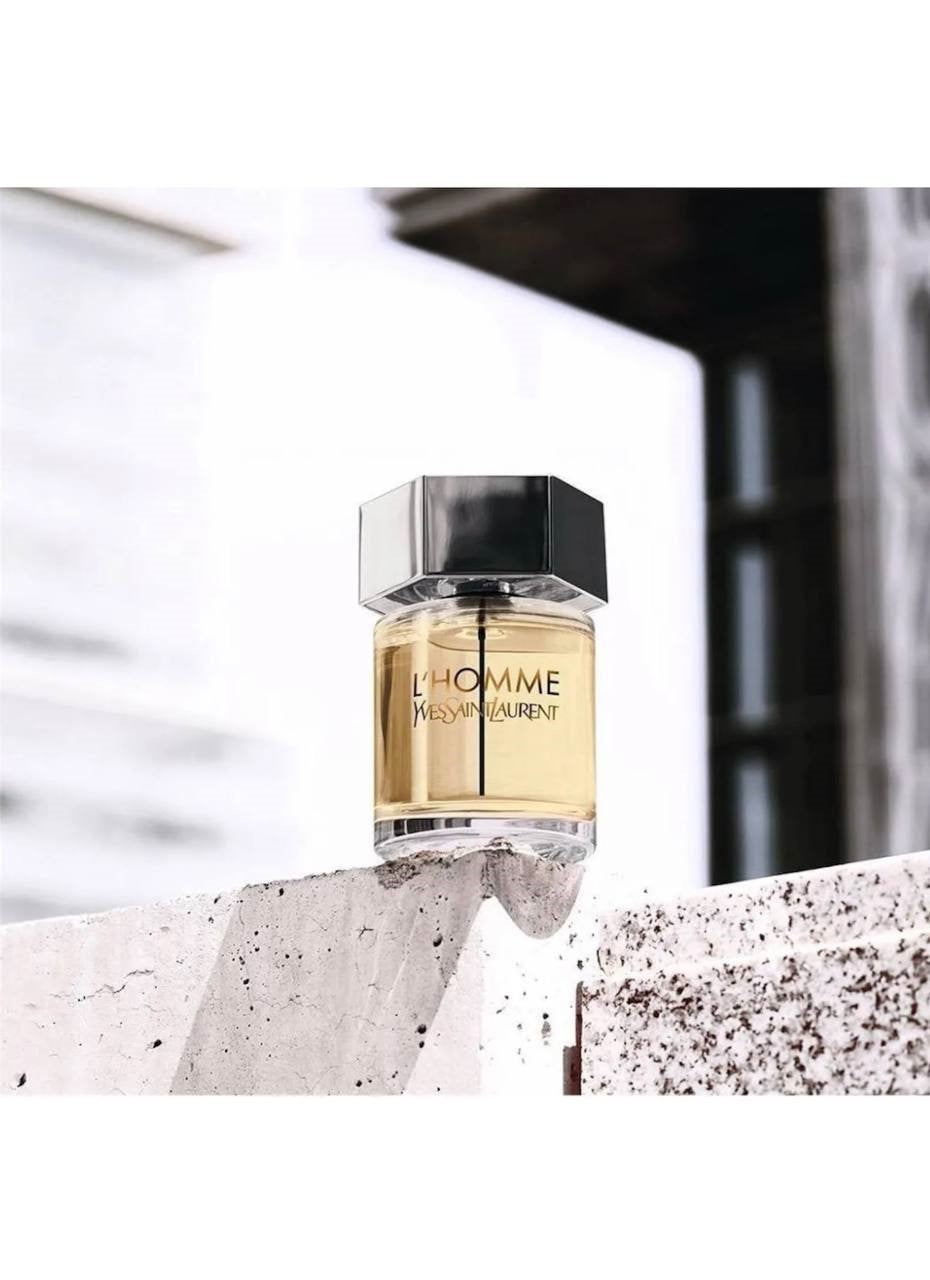 YSL L'Homme perfume bottle on a concrete surface with blurred background Monza outlet, monza fashion, shein outlet, shien outlet