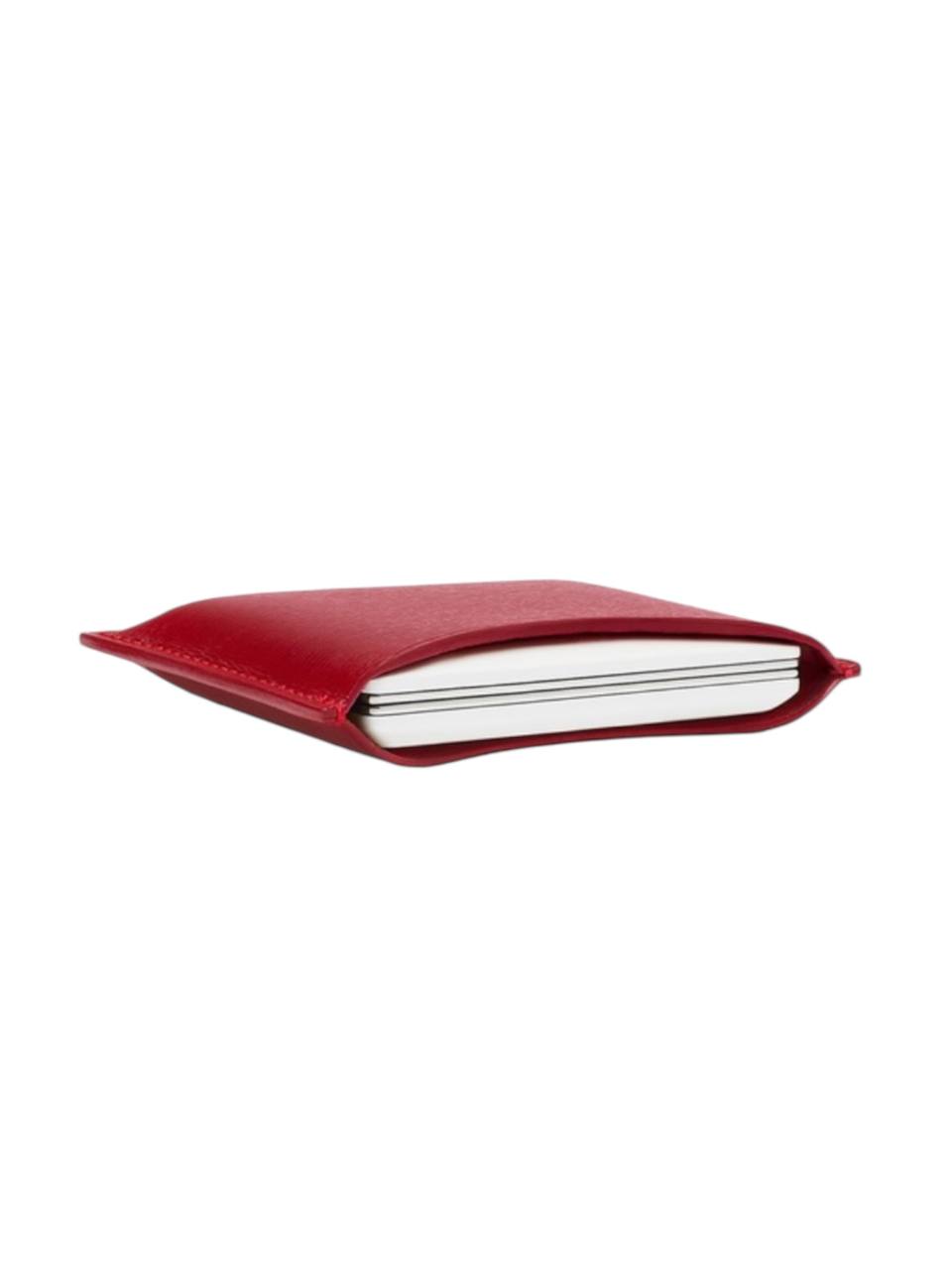Red notebook on a white background Monza outlet, monza fashion, shein outlet, shien outlet