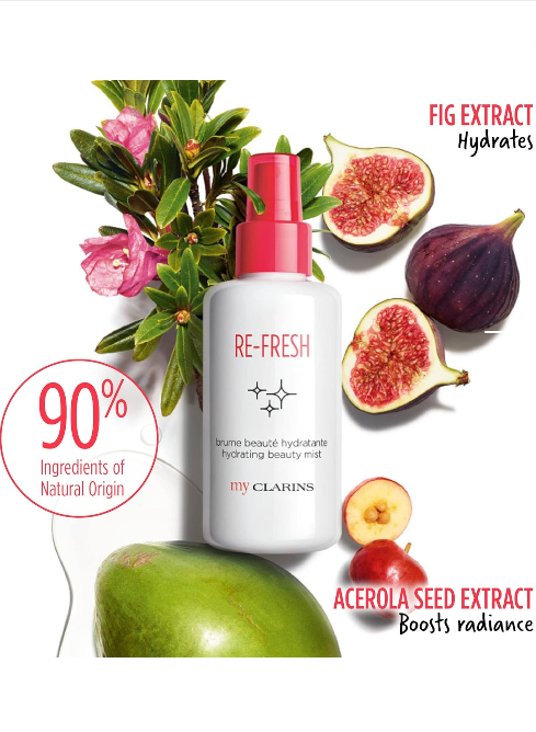 Beauty mist bottle with figs, flowers, and apples on a white background. Clarins, Monza Outlet, Monza Fashion, Shein Outlet