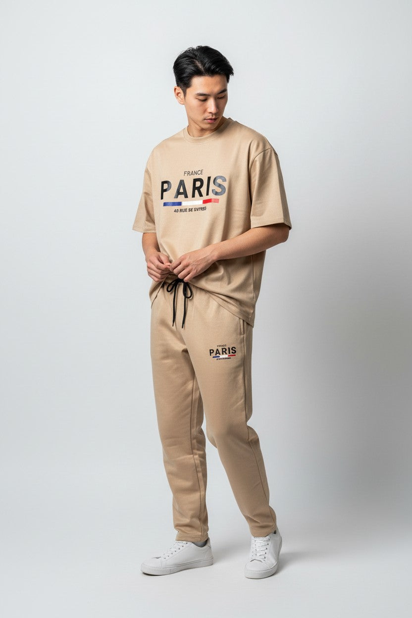 Person wearing a beige Paris themed outfit on a white background. Antler, Monza Outlet, Monza Fashion, Shein Outlet