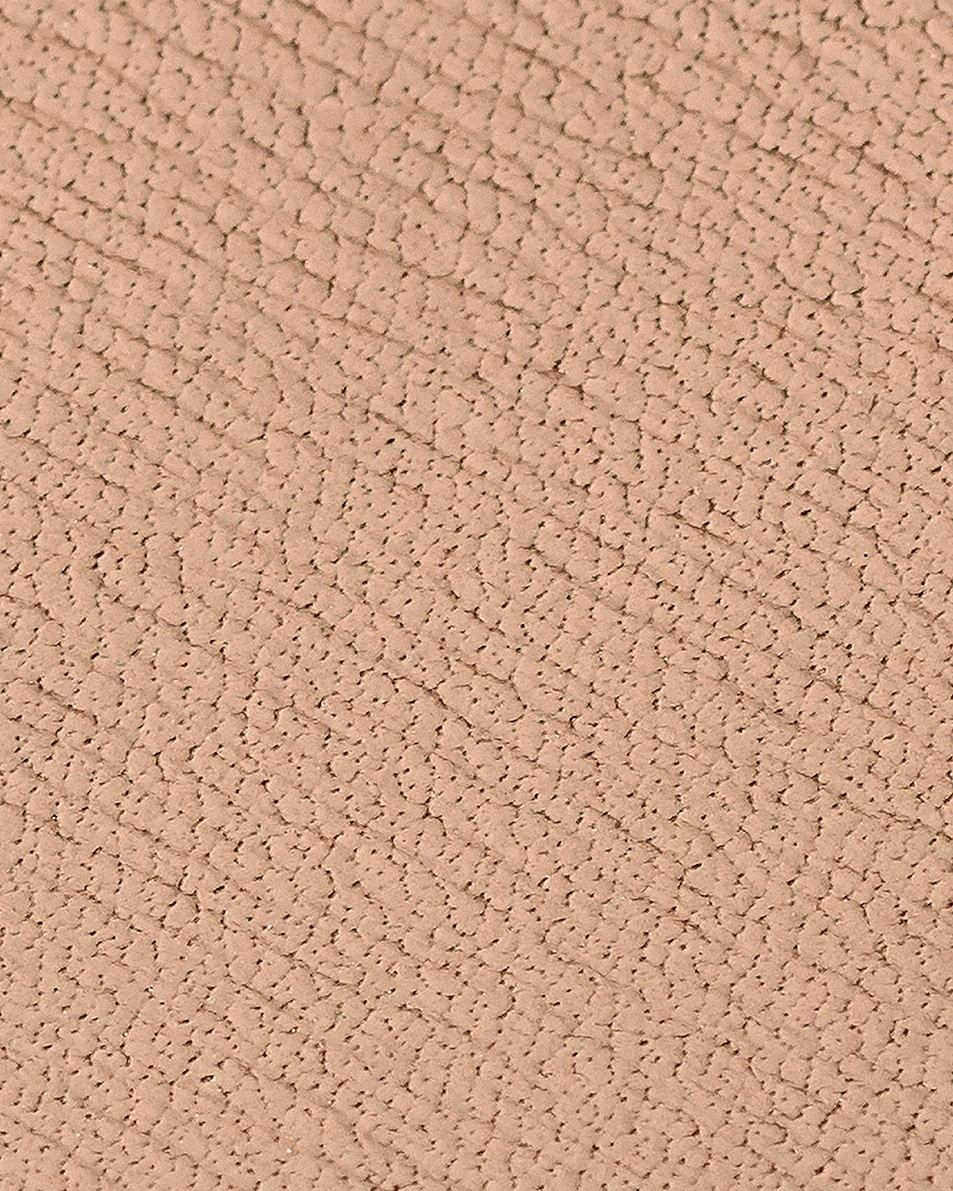 Close-up of a beige textured fabric surface