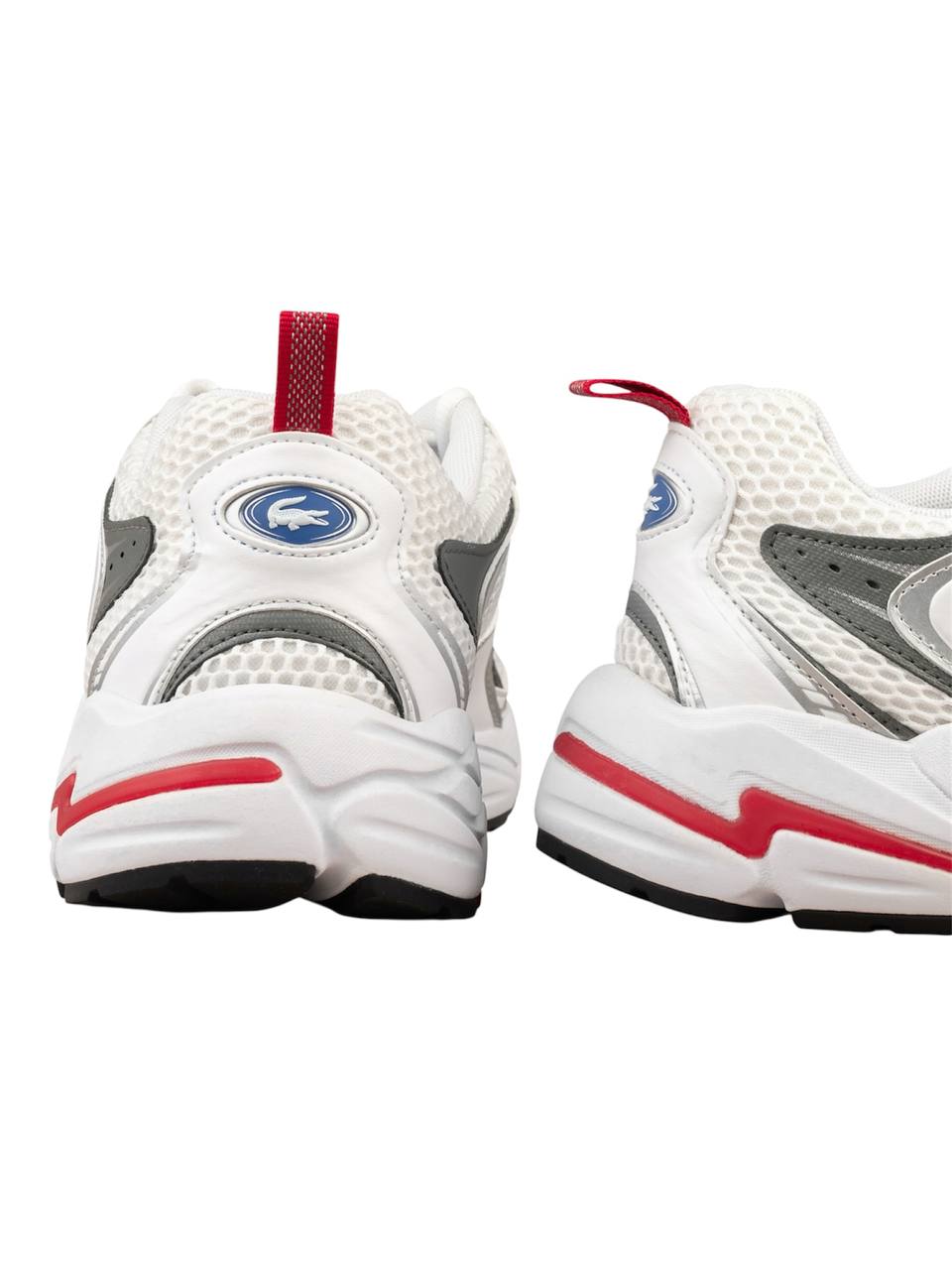 White athletic shoes with red accents on a white background Lacoste Monza Outlet