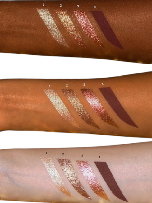 Swatches of lipsticks on three different arms with a neutral background. Pat McGrath Labs Monza Outlet