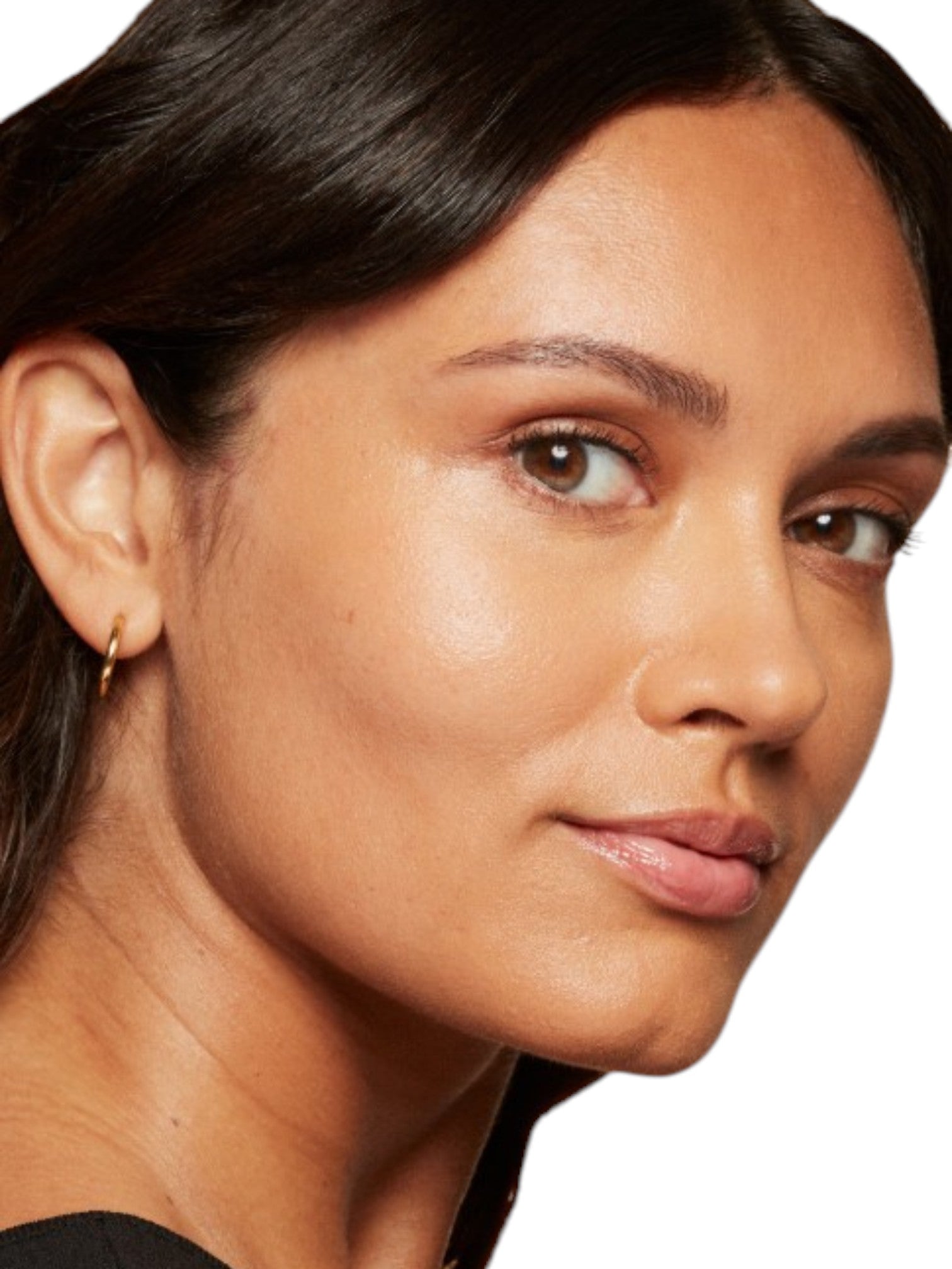 Close-up of a womans face with a neutral background. Bobbi Brown, Monza Outlet, Monza Fashion, Shein Outlet