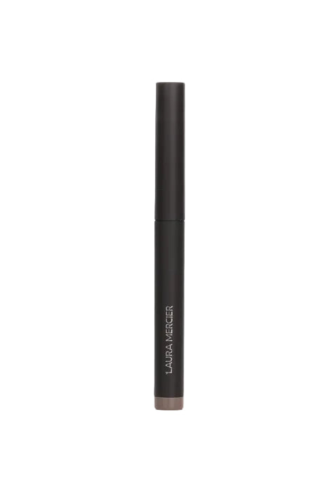 Black cosmetic pencil with Laura Mercier branding on a white background