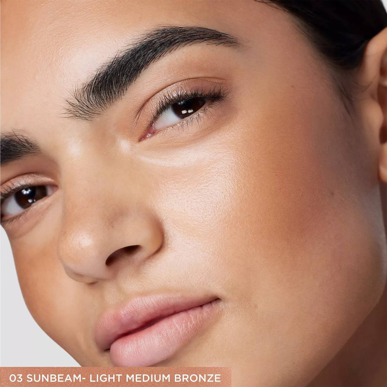 Close-up of a person's face with a neutral background, highlighting skin tone. Monza fashion outlet, monza outlet, shein outlet, shien outlet cosmetics, makeup, perfume