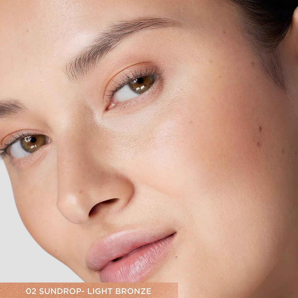 Close-up of a person's face with a neutral background Monza fashion outlet, monza outlet, shein outlet, shien outlet cosmetics, makeup, perfume