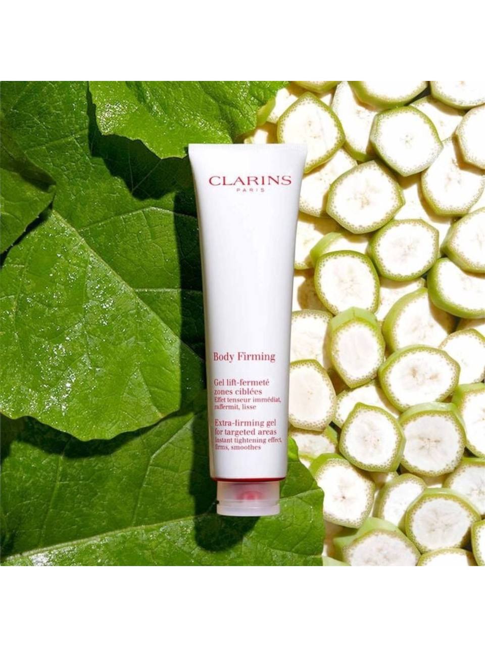 Clarins body firming gel with green leaves and white fruits in the background. Clarins, Monza Outlet, Monza Fashion, Shein Outlet