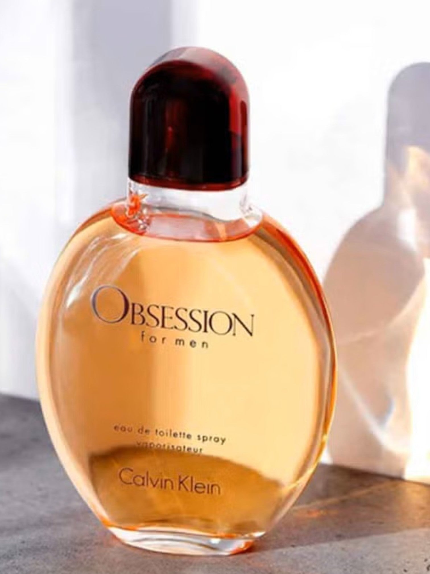 Calvin Klein Obsession for men eau de toilette spray bottle on a light background monza outlet, Shein outlet, monza fashion
