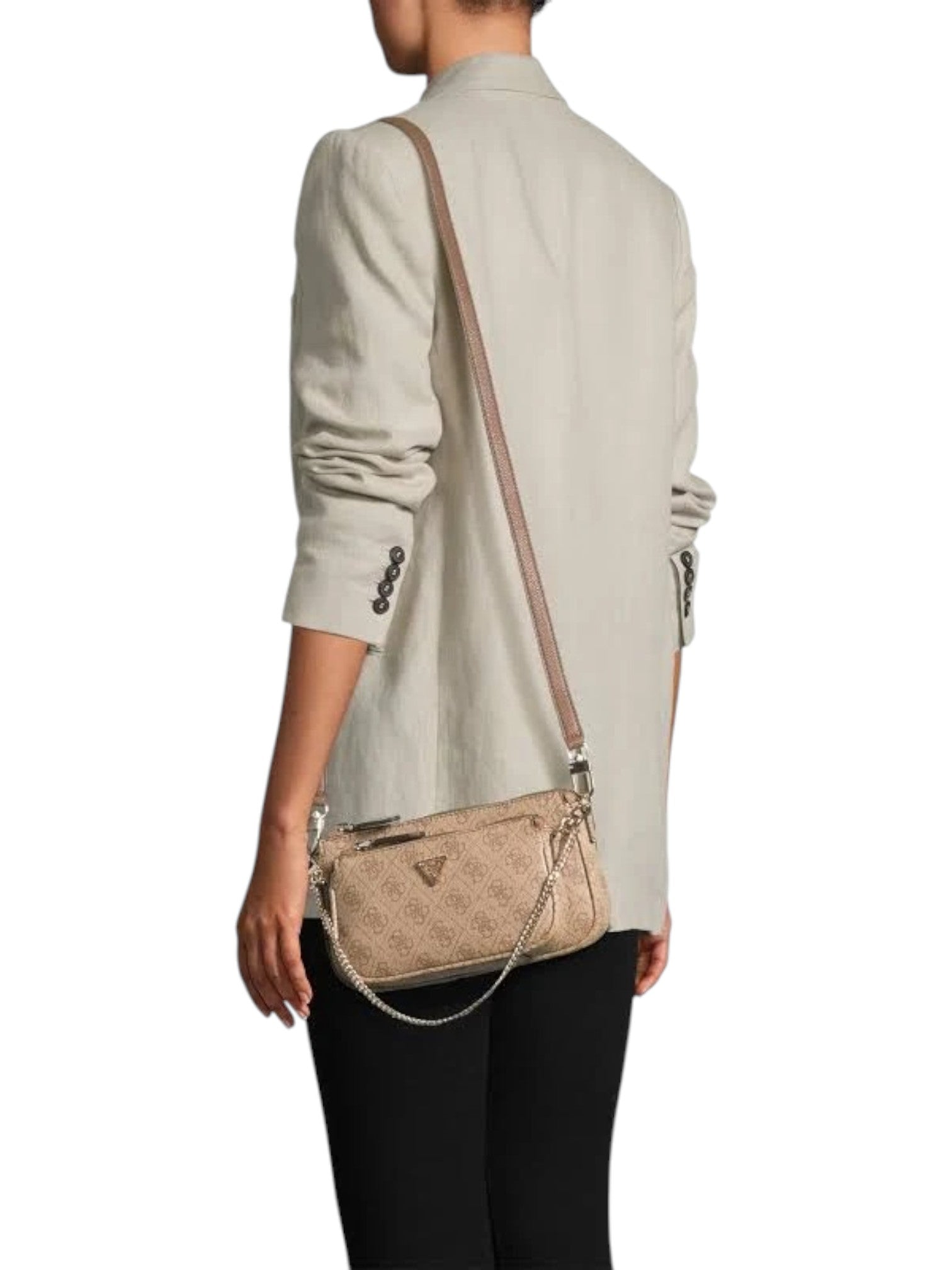 Person wearing a beige crossbody bag with a white background. Guess, Monza Outlet, Monza Fashion, Shein Outlet