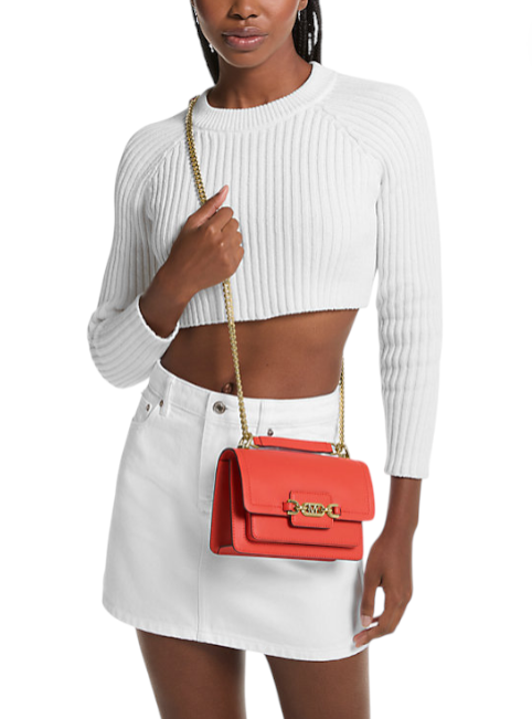 Woman holding a red handbag with a white background monza outlet, Shein outlet, monza fashion