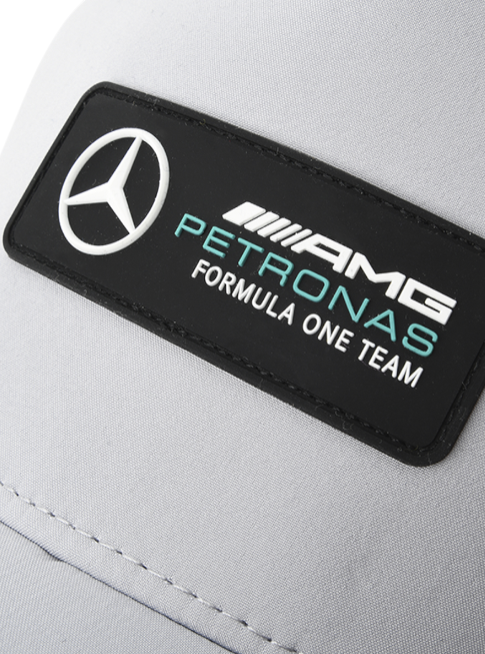 Close-up of a Mercedes-AMG Petronas Formula One Team logo on a gray background monza outlet, Shein outlet, monza fashion