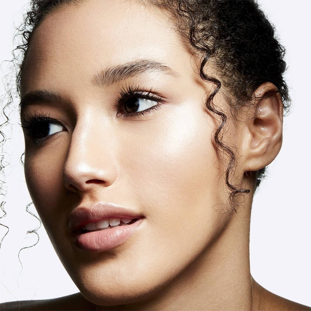 Close-up of a woman's face with a neutral background Monza fashion outlet, monza outlet, shein outlet, shien outlet cosmetics, makeup, perfume