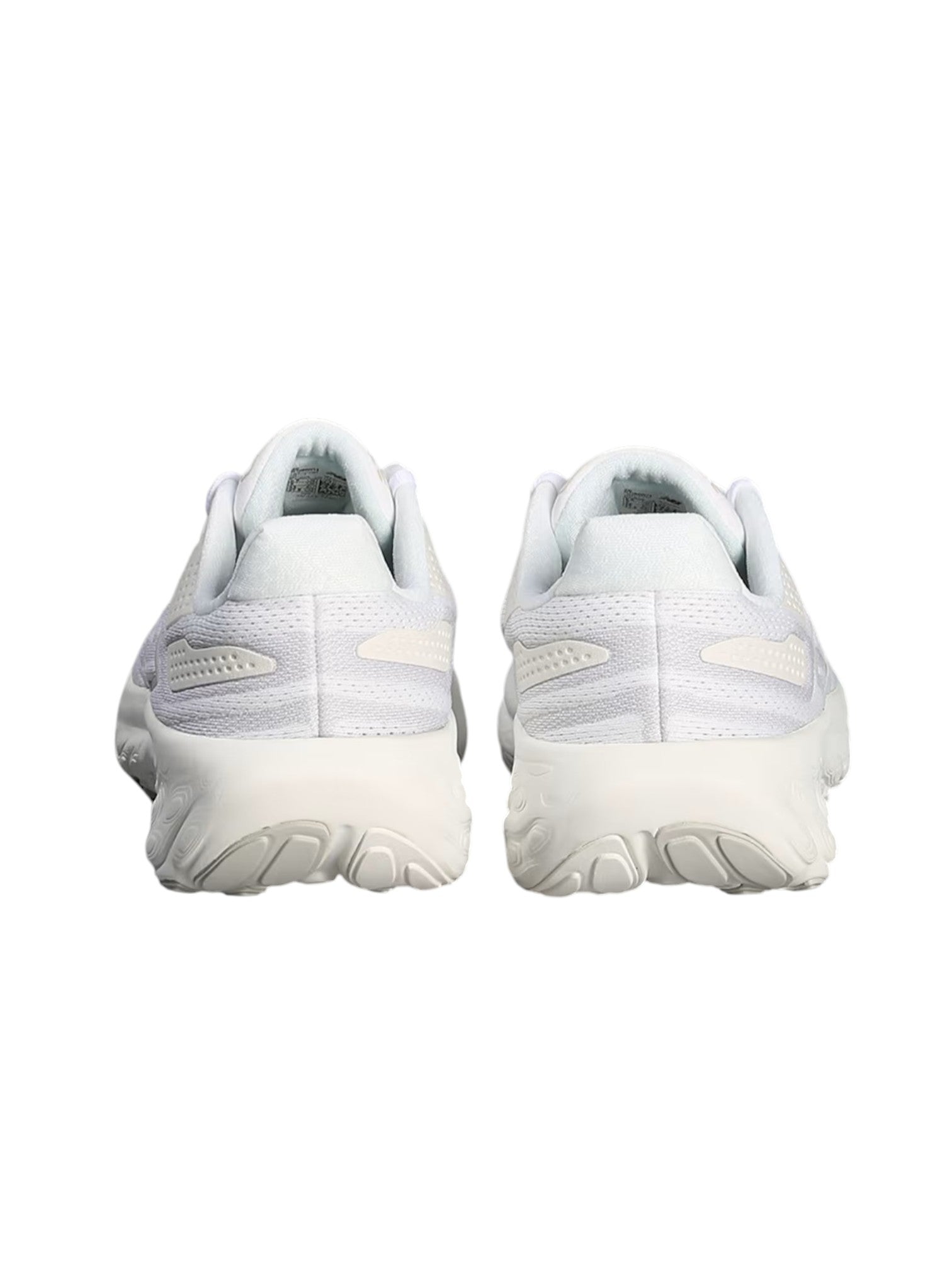 White athletic shoes on a white background. New Balance, Monza Outlet, Monza Fashion, Shein Outlet