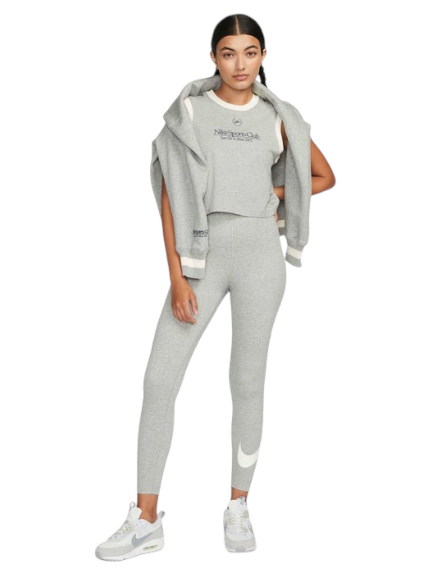 Woman wearing a gray Nike tracksuit on a white background. Nike, Monza Outlet, Monza Fashion, Shein Outlet
