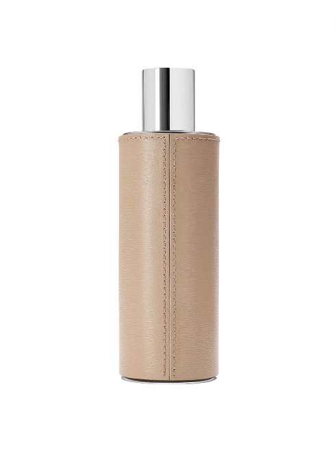 Bottle with beige leather wrap and silver cap on a white background
