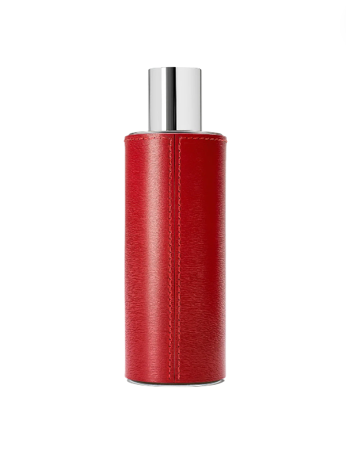 Red cylindrical bottle with silver cap on a white background