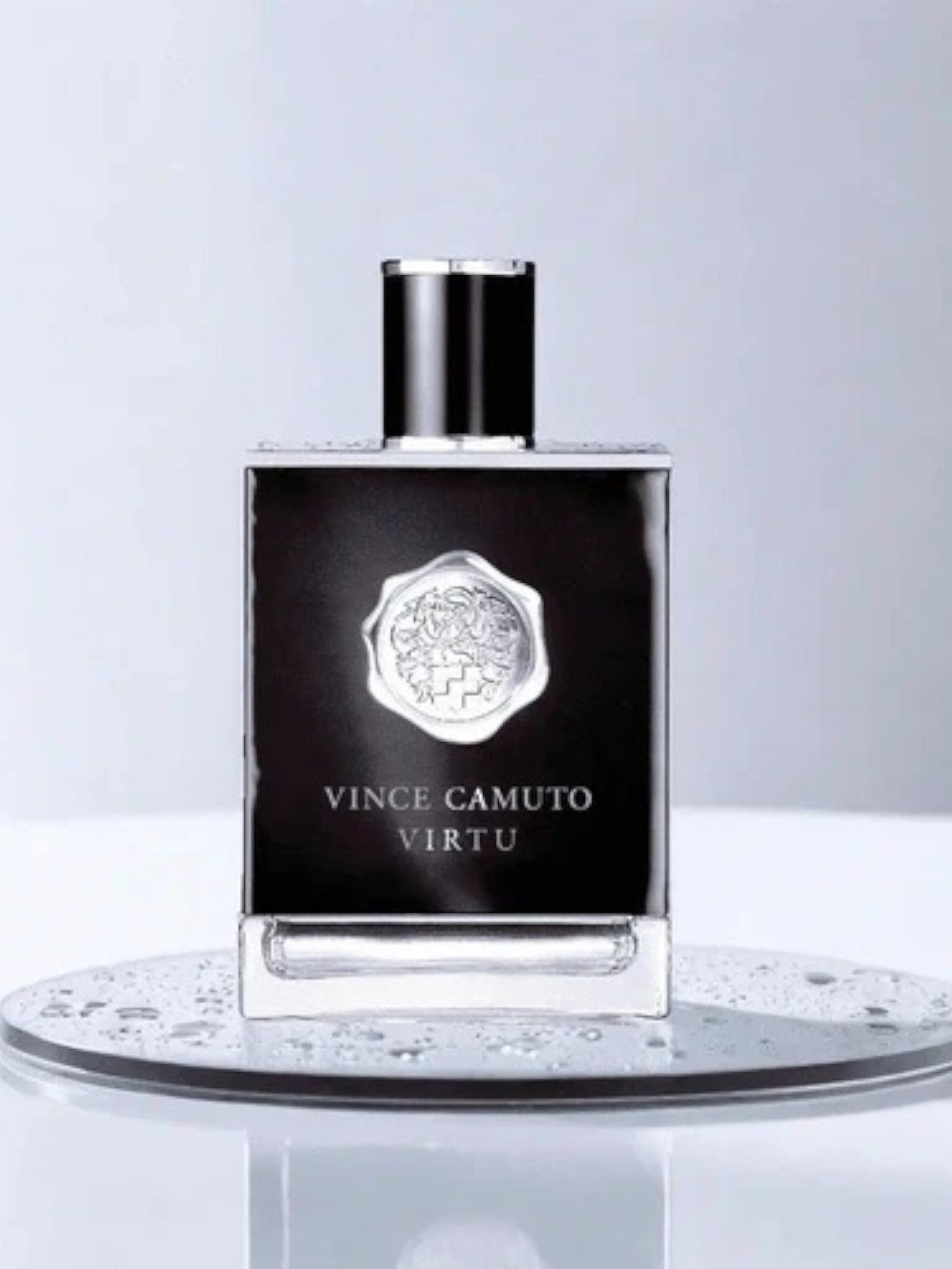 Vince Camuto Virtu perfume bottle on a reflective surface with a light gray background. Vince Camuto, Monza Outlet, Monza Fashion, Shein Outlet