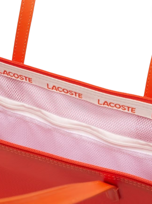 Close-up of a Lacoste bag with visible branding on a white background Lacoste Monza Outlet Monza Italy