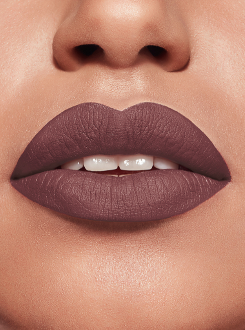 Close-up of a person's lips wearing a mauve lipstick Bourjois Monza Outlet