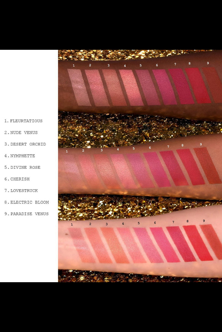 Swatches of lipsticks in various shades on a glittery background. Monza Outlet