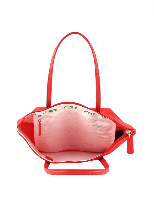 Red handbag with visible branding on a white background Lacoste Monza Outlet, Monza Fashion, Shein Outlet