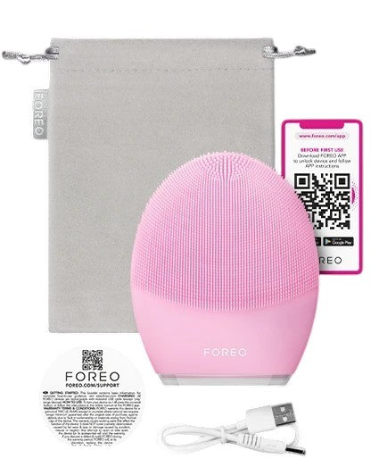 Pink FOREO device with USB cable and gray pouch on a white background Monza Outlet