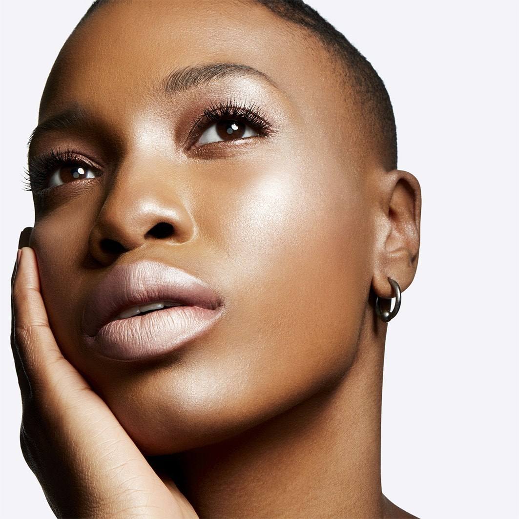 Close-up of a woman's face with a neutral background Monza fashion outlet, monza outlet, shein outlet, shien outlet cosmetics, makeup, perfume