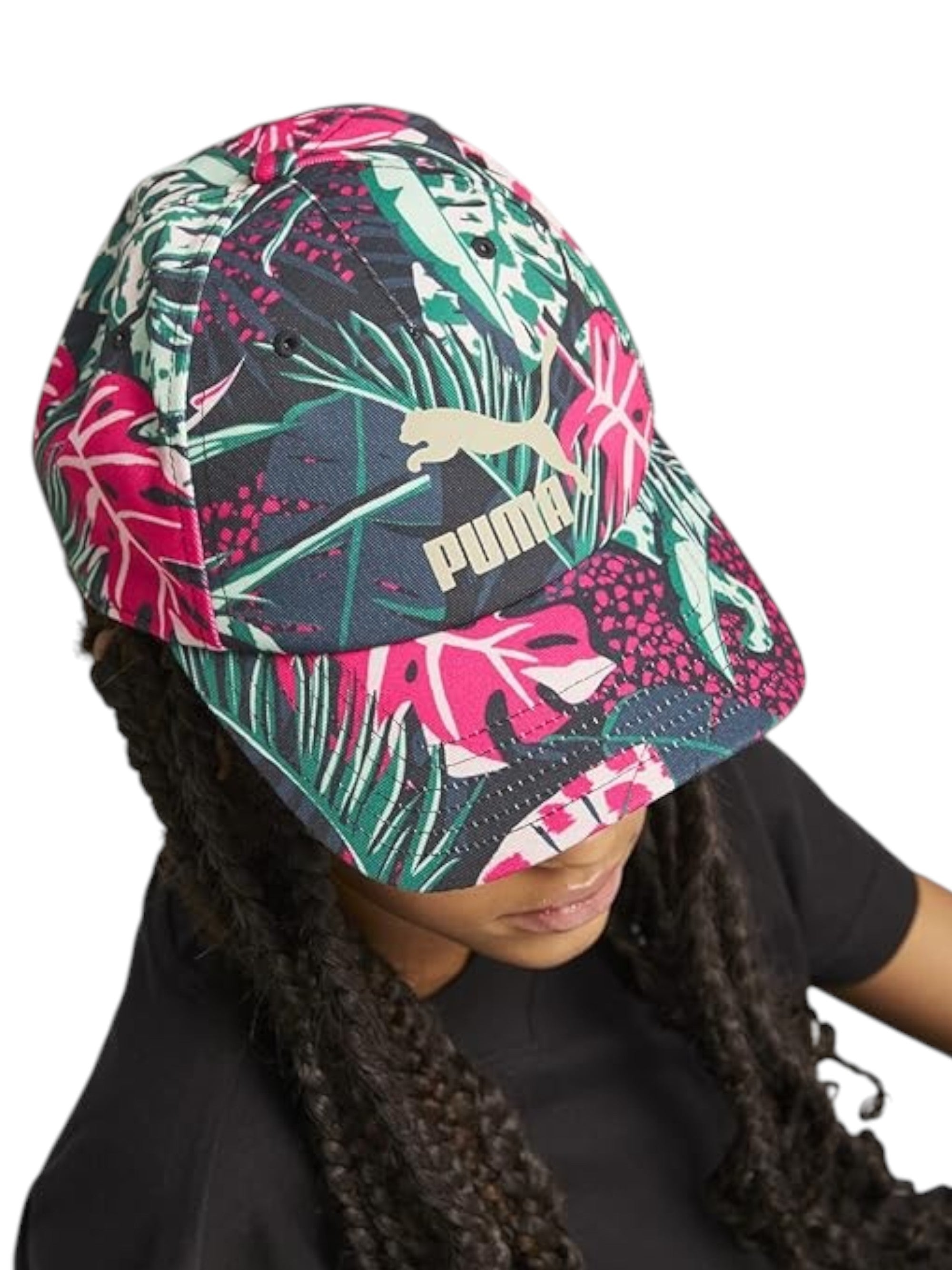 Person wearing a colorful tropical patterned cap on a white background monza outlet, Shein outlet, monza fashion