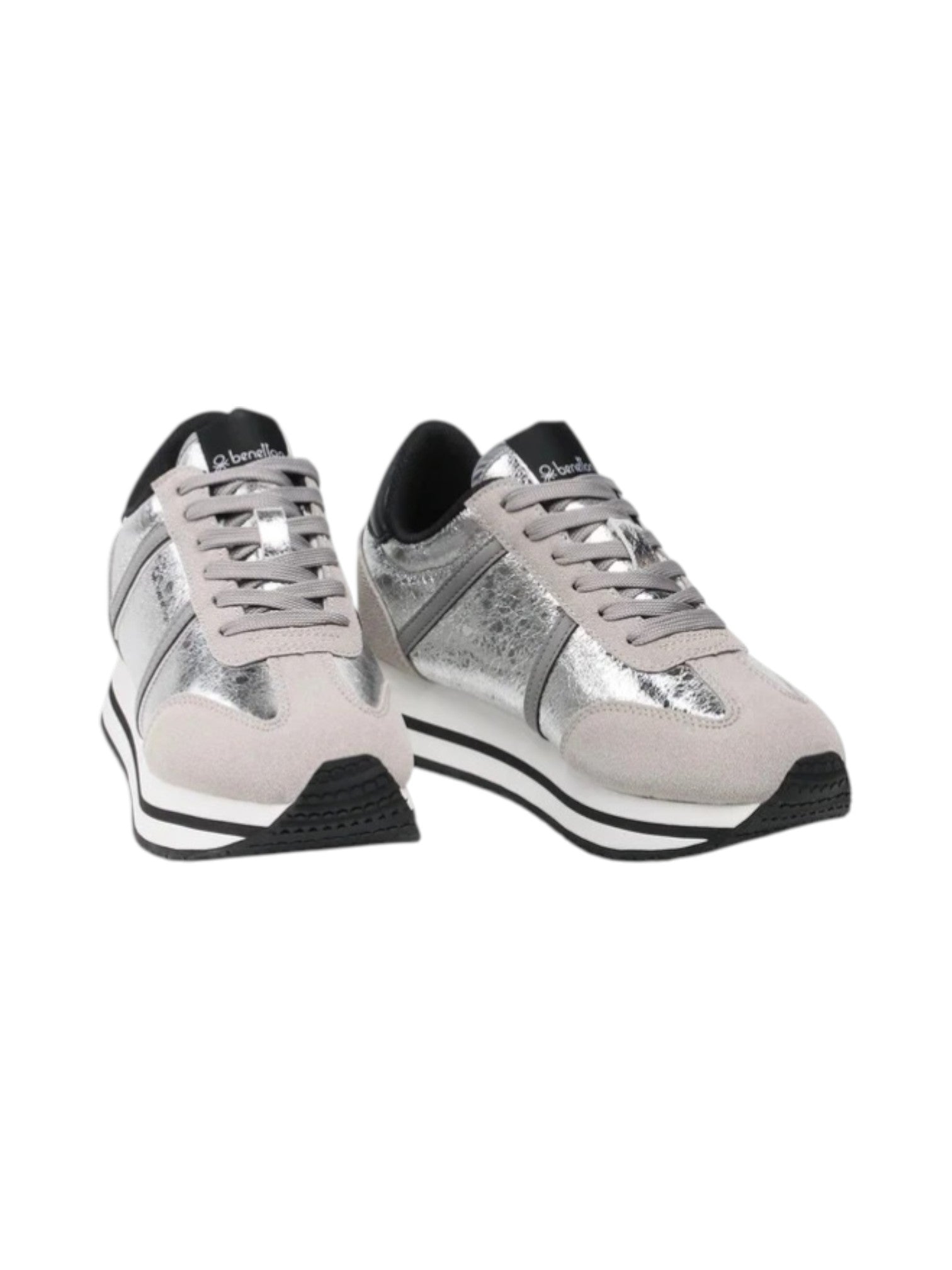 Pair of silver and black sneakers on a white background. United Colors of Benetton, Monza Outlet, Monza Fashion, Shein Outlet