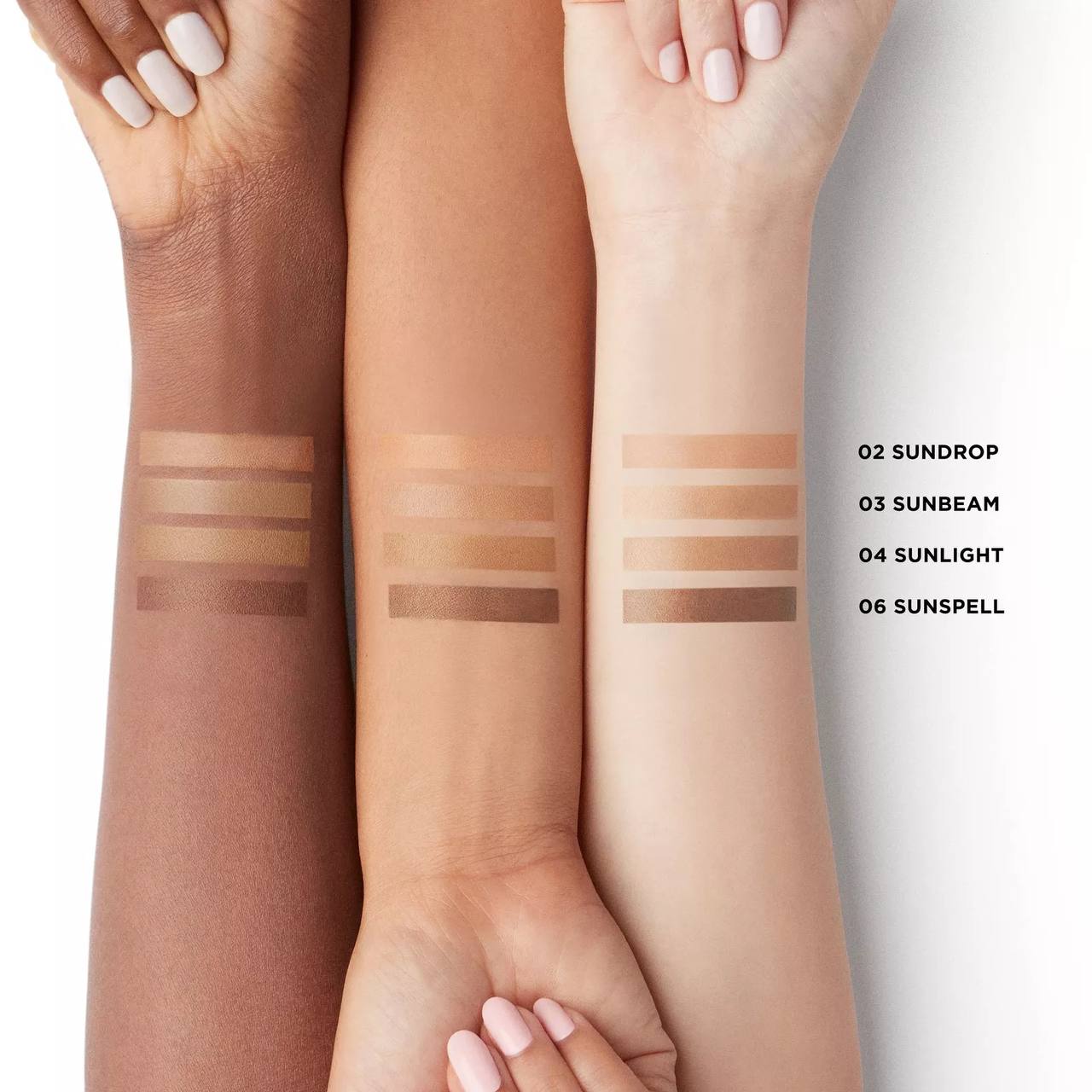Three arms with different skin tones displaying makeup swatches labeled '02 Sundrop', '03 Sunbeam', '04 Sunlight', and '06 Sunspear'. Monza fashion outlet, monza outlet, shein outlet, shien outlet cosmetics, makeup, perfume