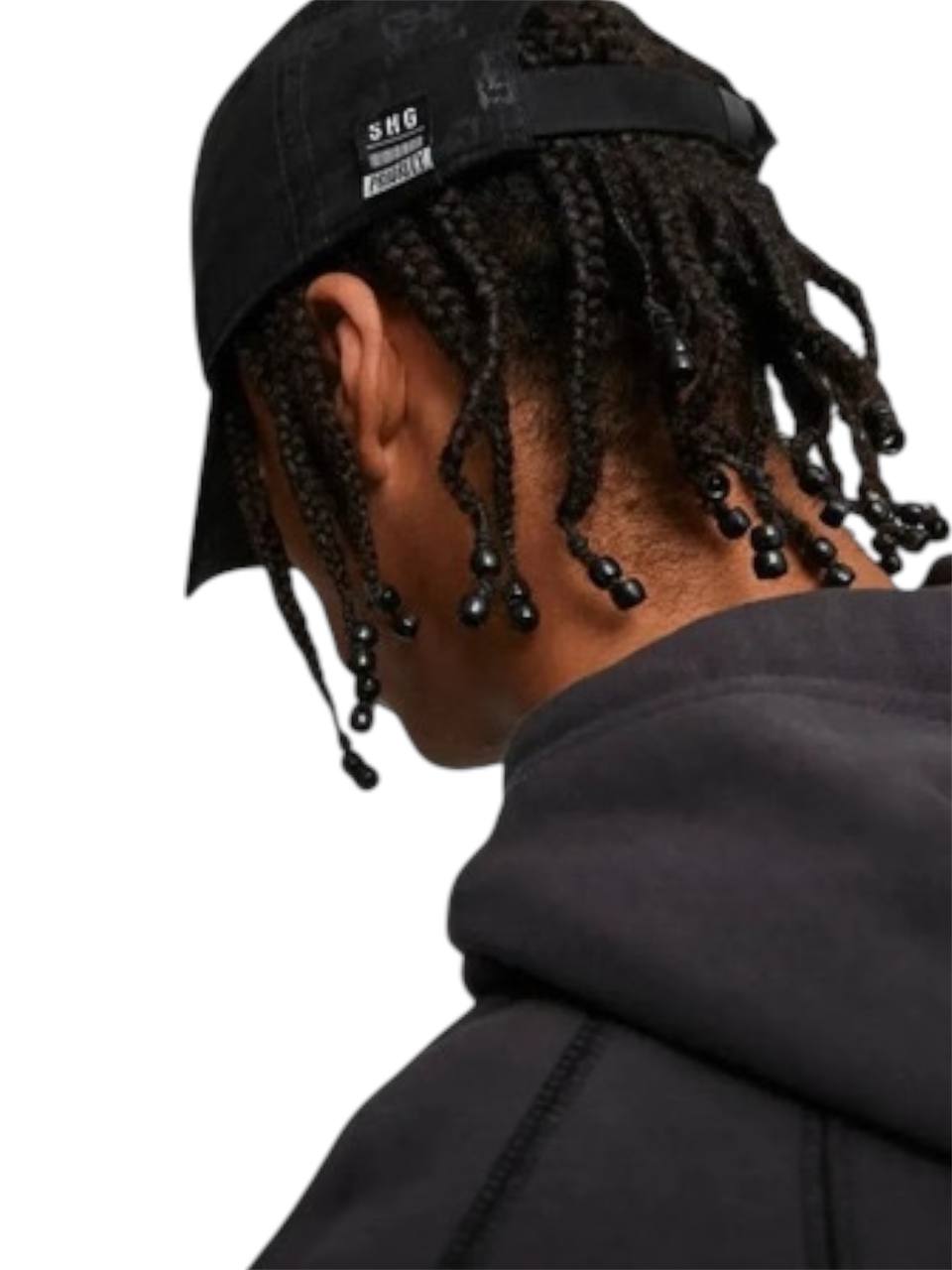Person wearing a black cap and hoodie with braided hair, facing away from the camera. monza outlet, Shein outlet, monza fashion