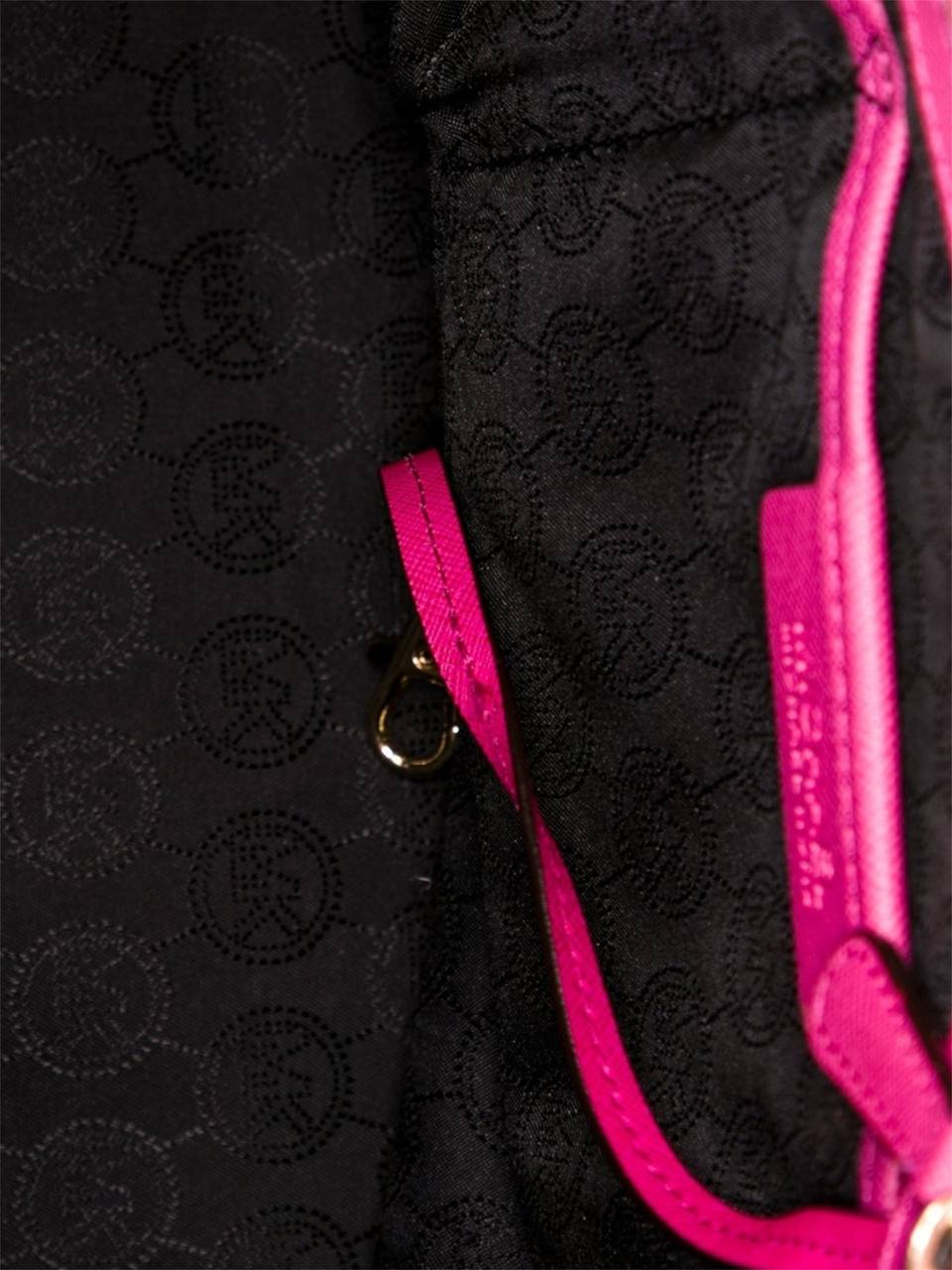 Close-up of black textured fabric with pink trim and buttons. monza outlet, Shein outlet, monza fashion