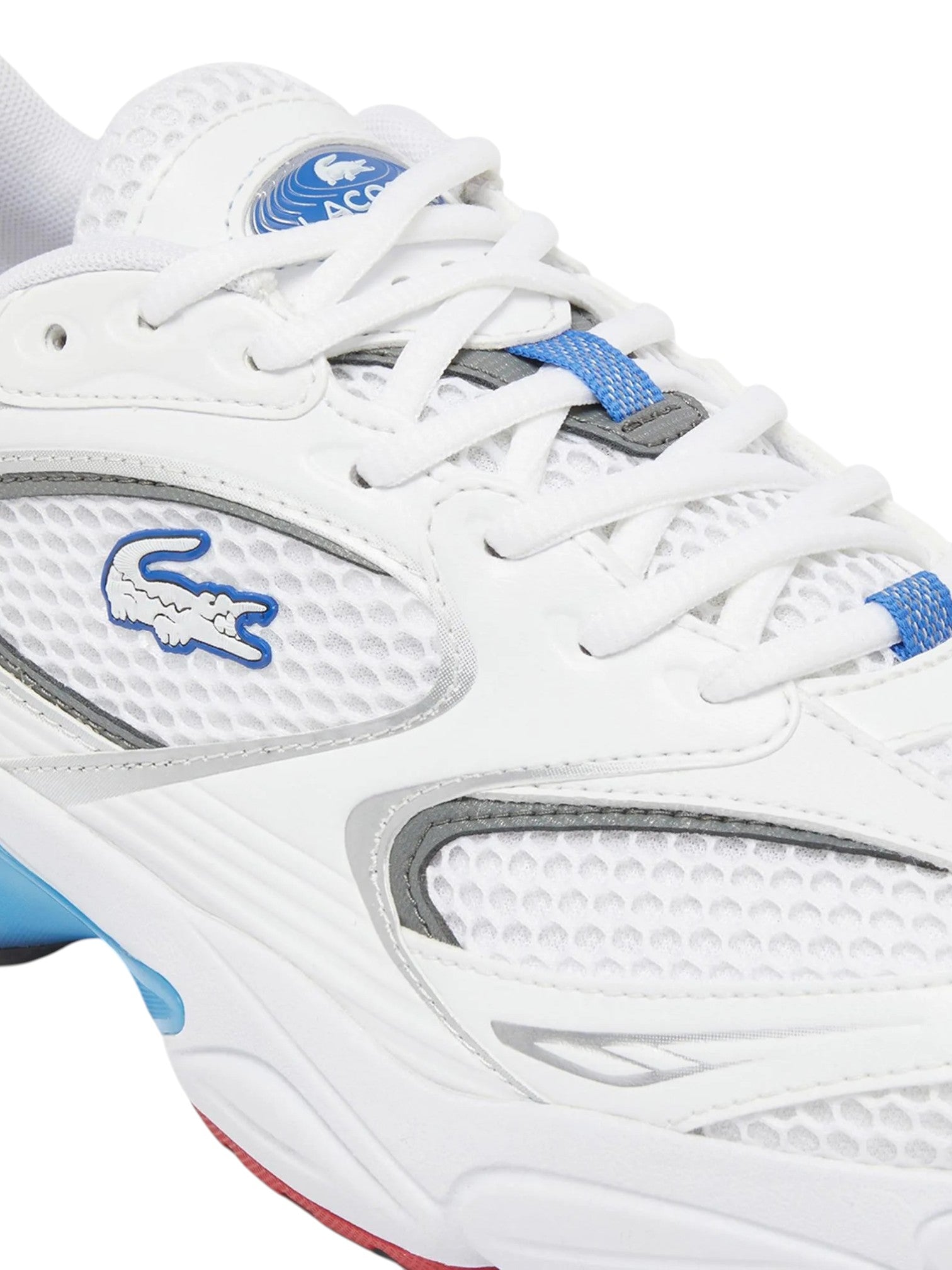 White sneaker with blue accents and brand logo on a white background. Lacoste, Monza Outlet, Monza Fashion, Shein Outlet