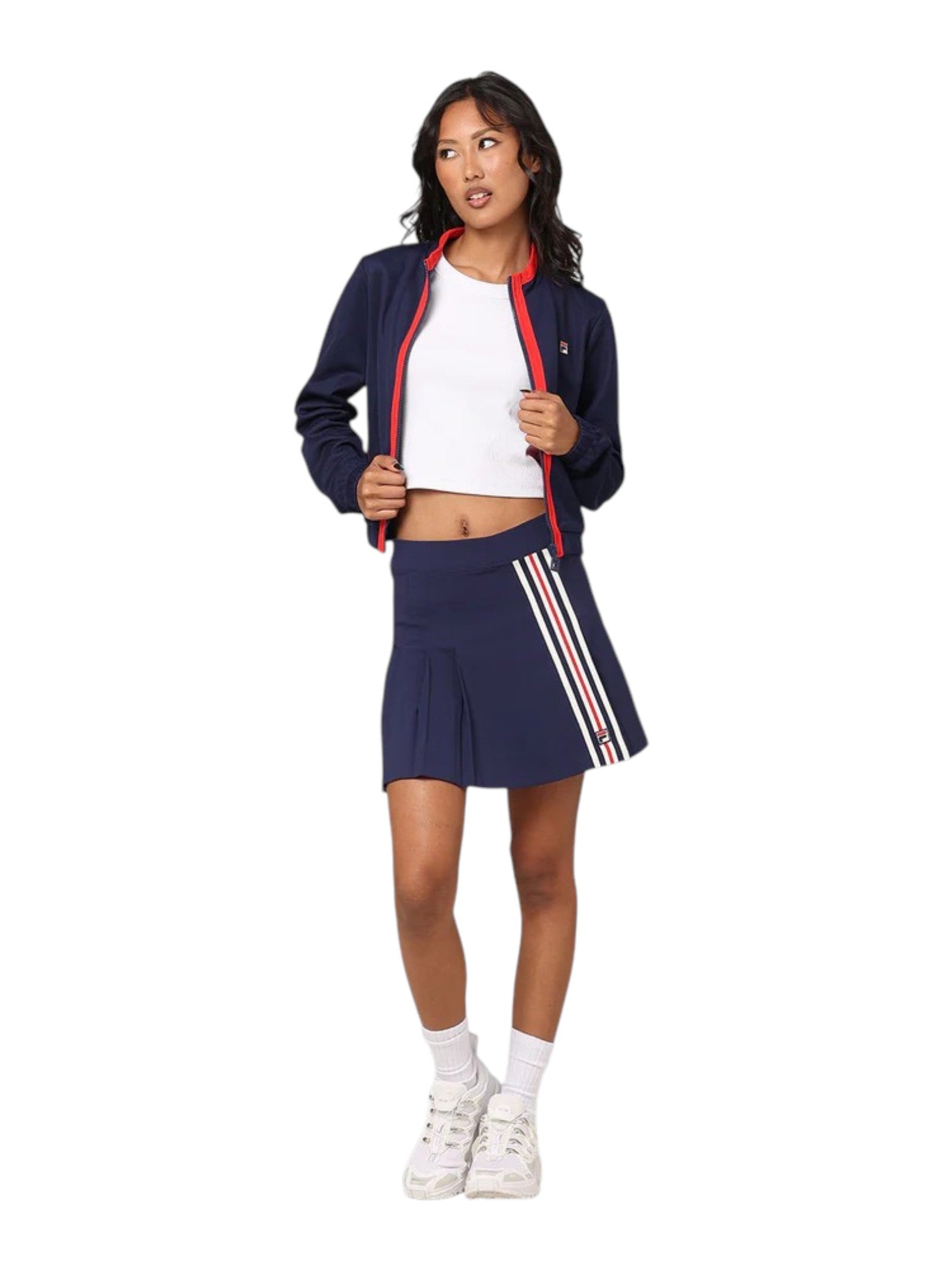 Woman wearing a navy tracksuit with red accents on a white background. Fila, Monza Outlet, Monza Fashion, Shein Outlet