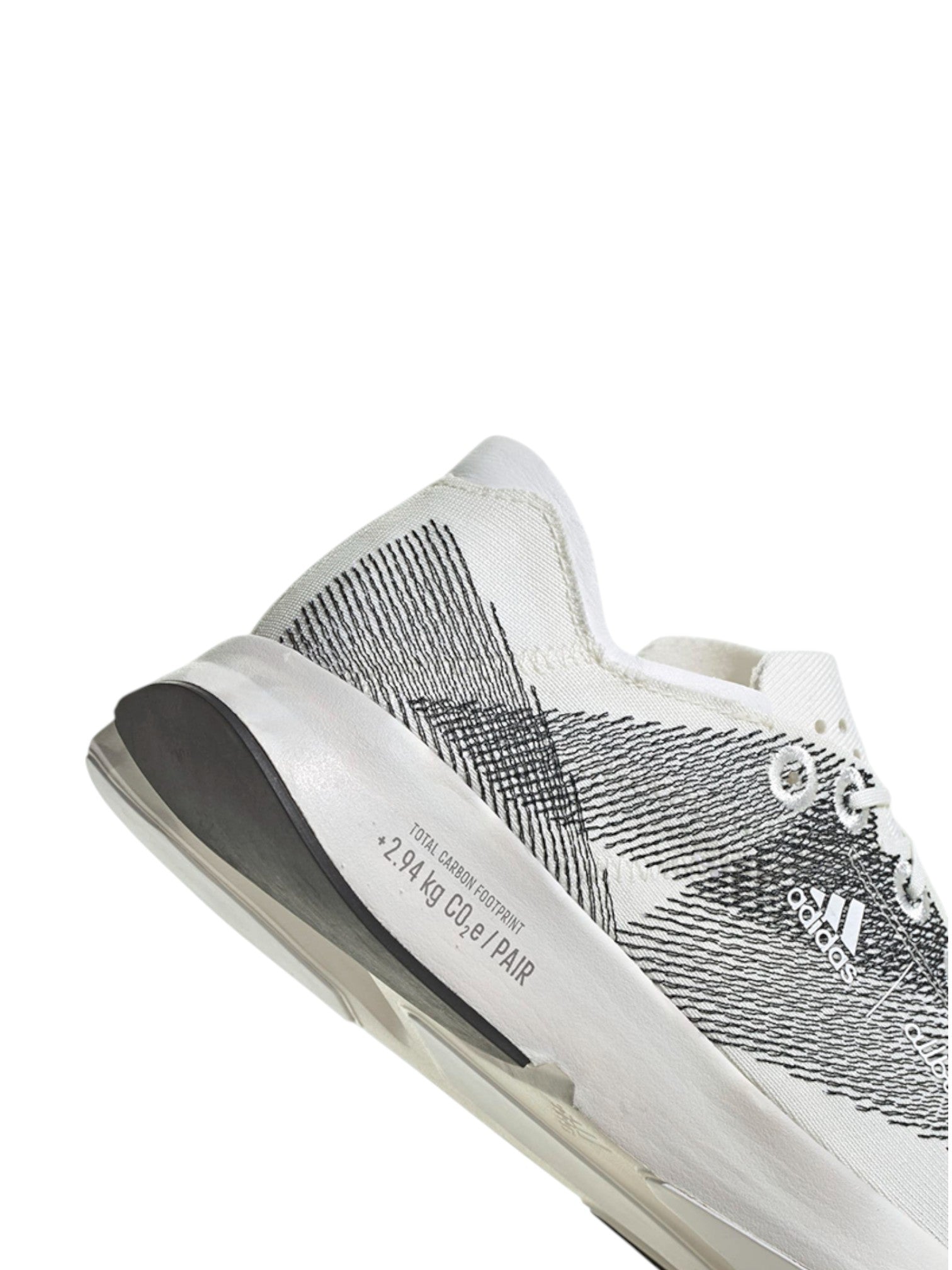 White sneaker with black pattern on a white background. Adidas, Monza Outlet, Monza Fashion, Shein Outlet