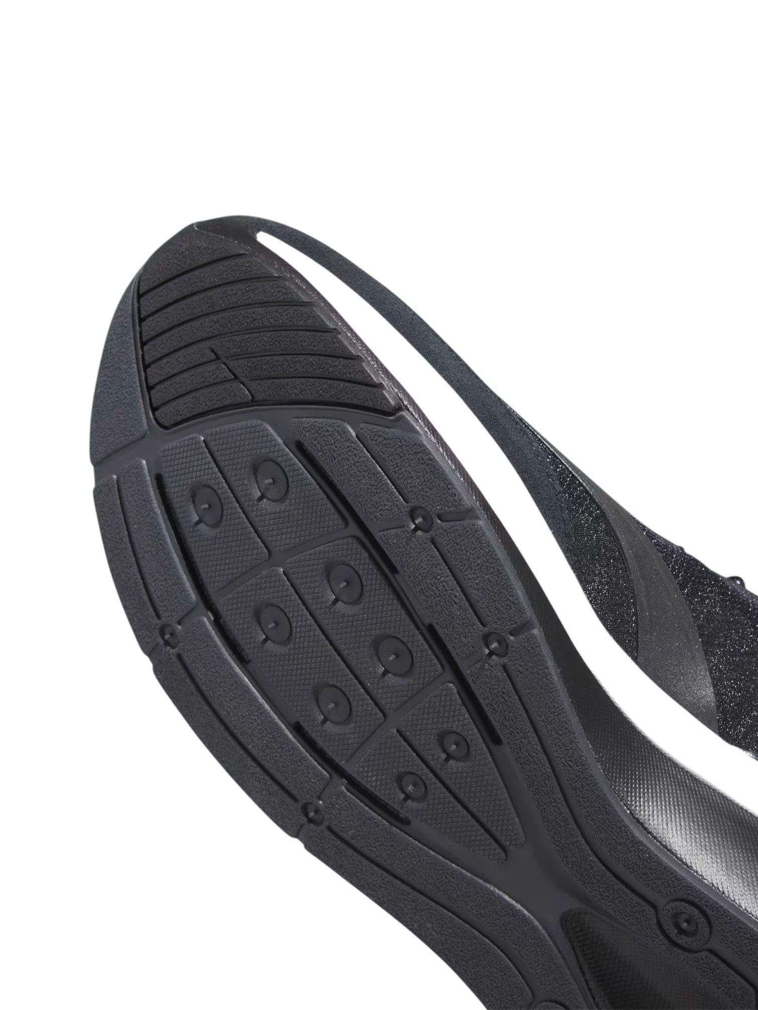Close-up of a black athletic shoe sole on a white background. Adidas, Monza Outlet, Monza Fashion, Shein Outlet