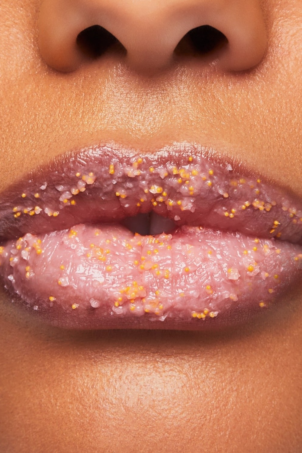 Close-up of lips with glittery lip gloss on a close-up of a person's face. Monza fashion outlet, monza outlet, shein outlet, shien outlet cosmetics, makeup, perfume