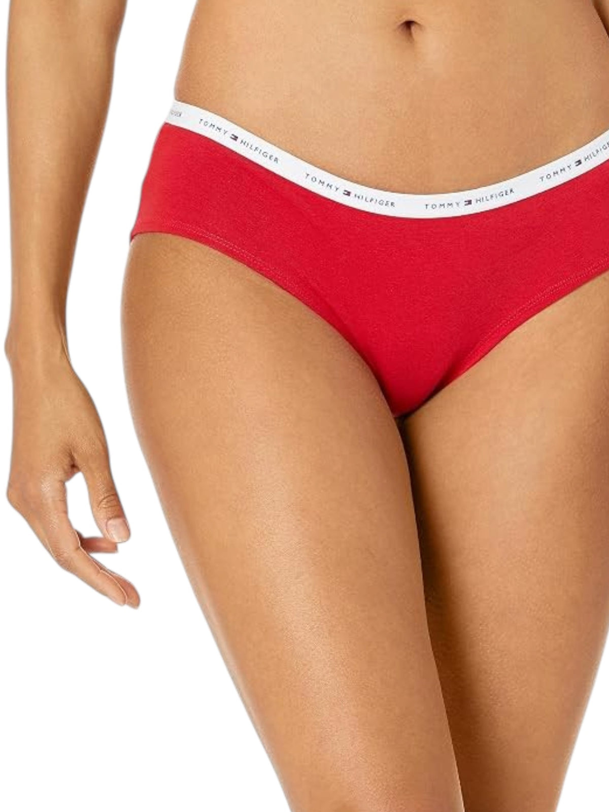 A close up of a model wearing bright red Tommy Hilfiger bikini style underwear with a white waistband printed with the Tommy Hilfiger logo. Tommy Hilfiger, Monza Outlet, Monza Fashion, Shein Outlet