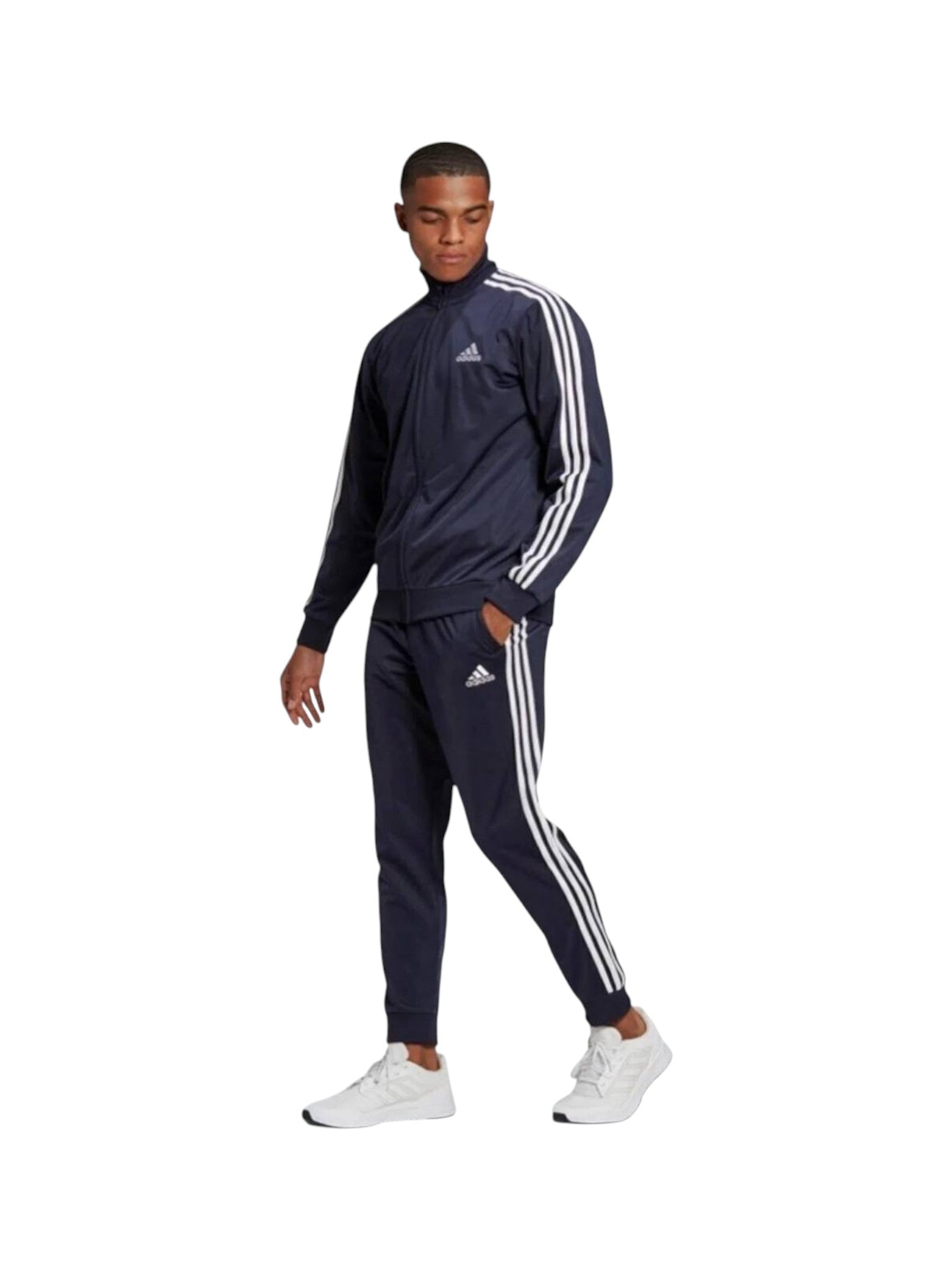 Person wearing a navy Adidas tracksuit with white stripes on a white background. Adidas, Monza Outlet, Monza Fashion, Shein Outlet