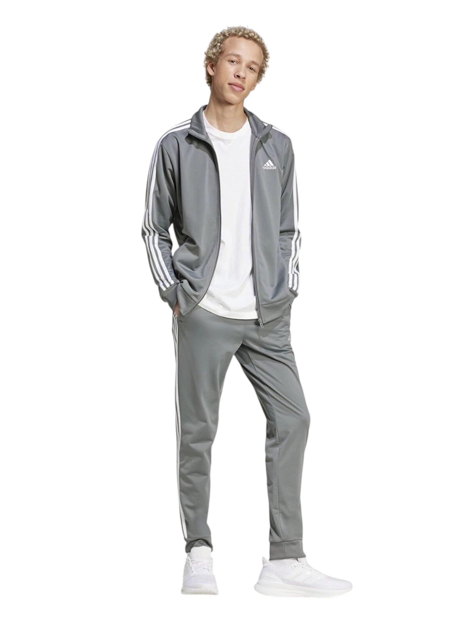 Person wearing a gray Adidas tracksuit on a white background. Adidas, Monza Outlet, Monza Fashion, Shein Outlet