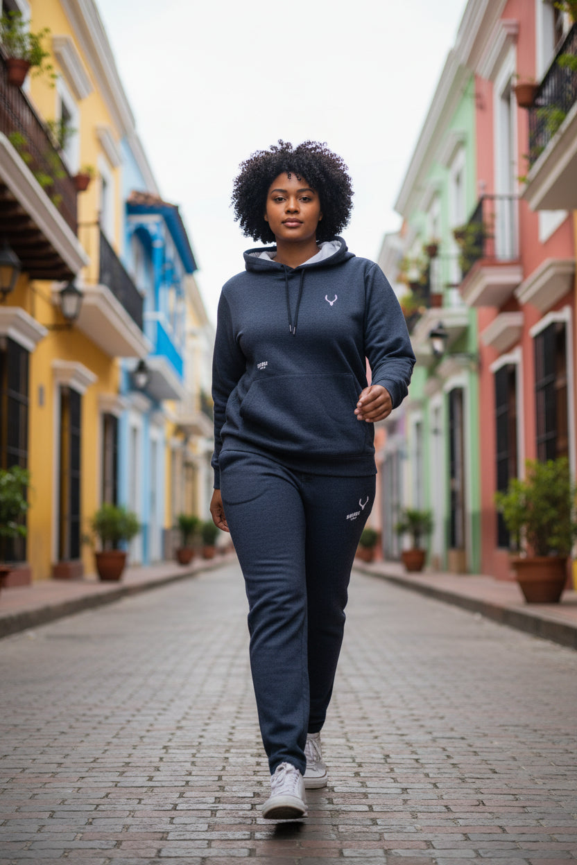 Person wearing a navy blue tracksuit walking on a colorful street. Antler, Monza Outlet, Monza Fashion, Shein Outlet