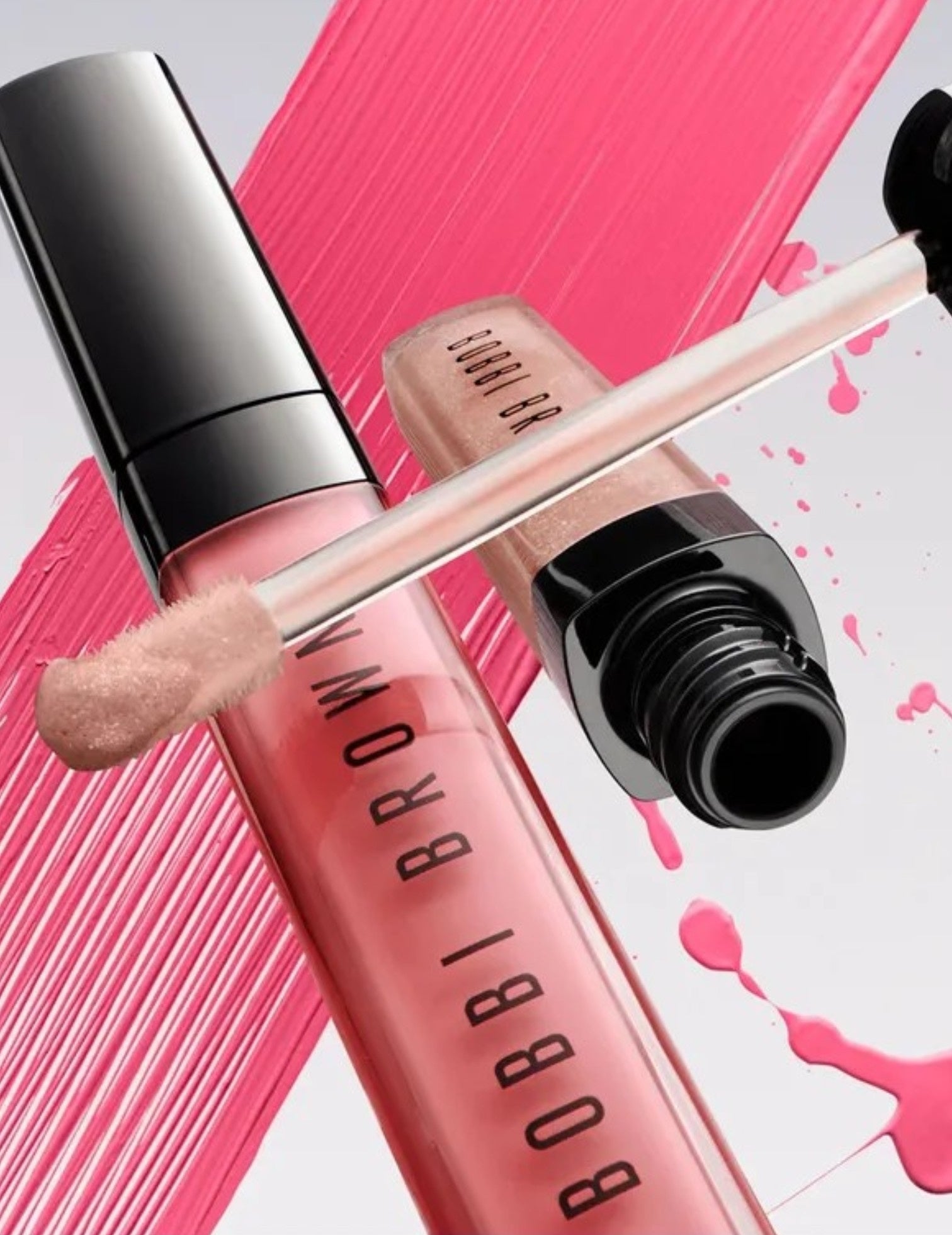 Bobbi Brown lip gloss with applicator on a pink and white background. Bobbi Brown, Monza Outlet, Monza Fashion, Shein Outlet